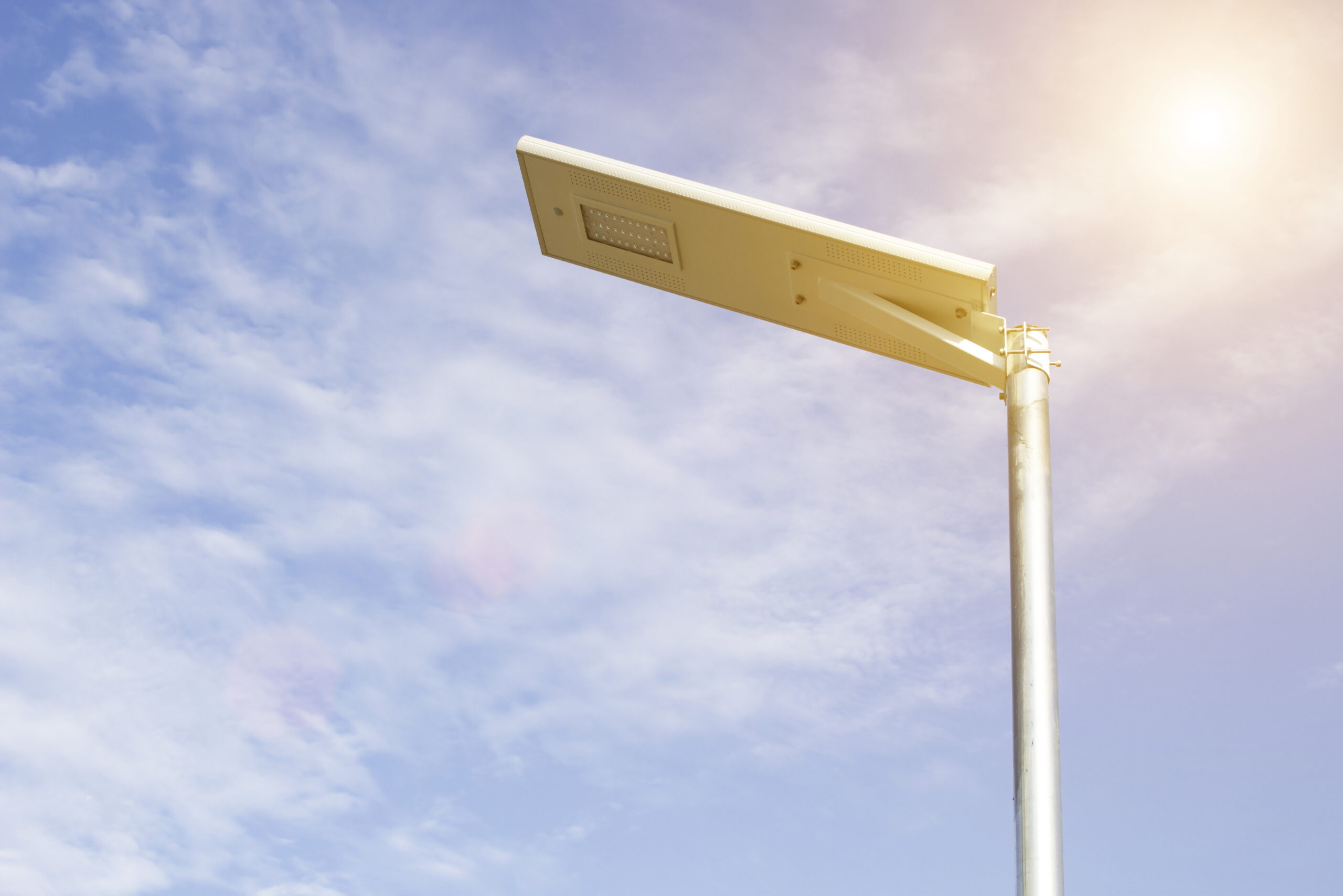Electric poles illuminated with solar cells and clear blue sky for sidewalks or parks.
