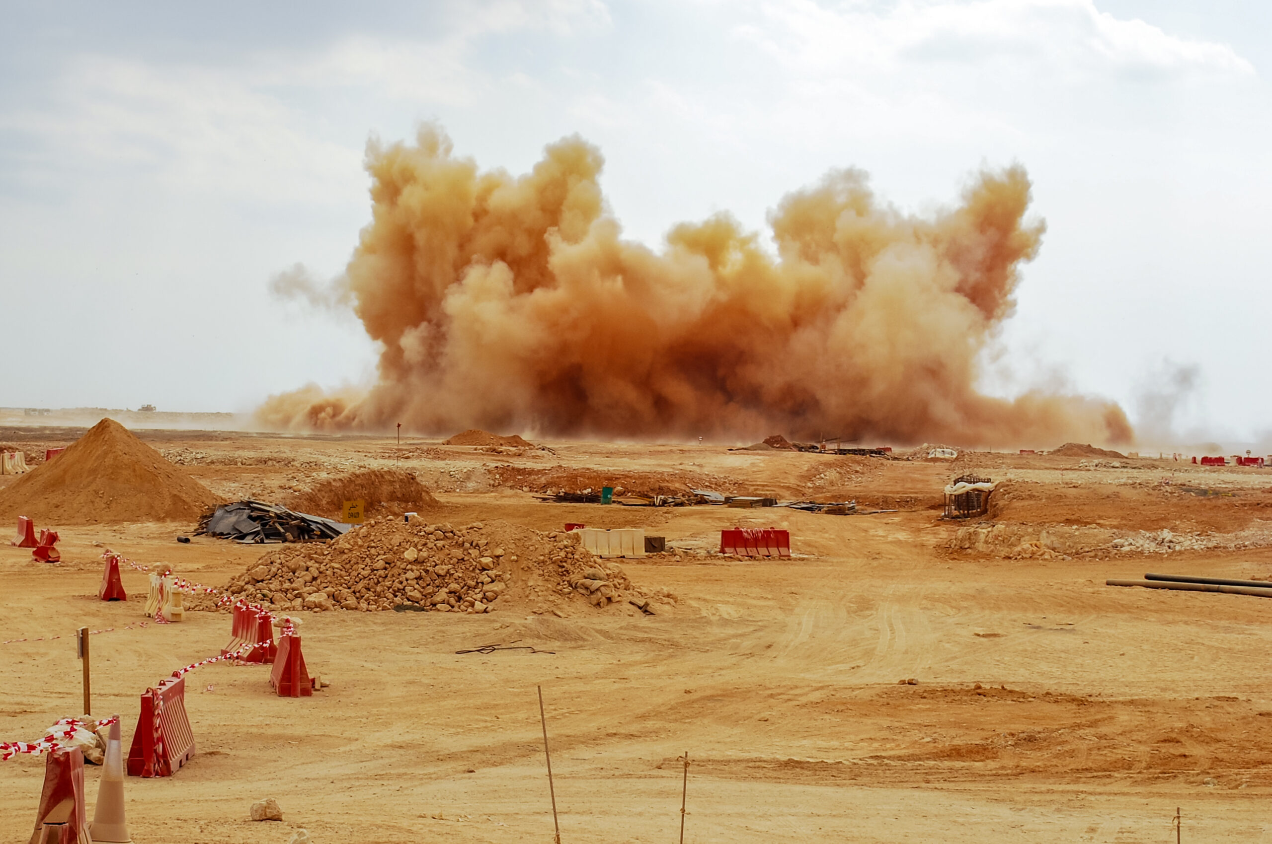 Dust clouds during detonator blast on the construction site
